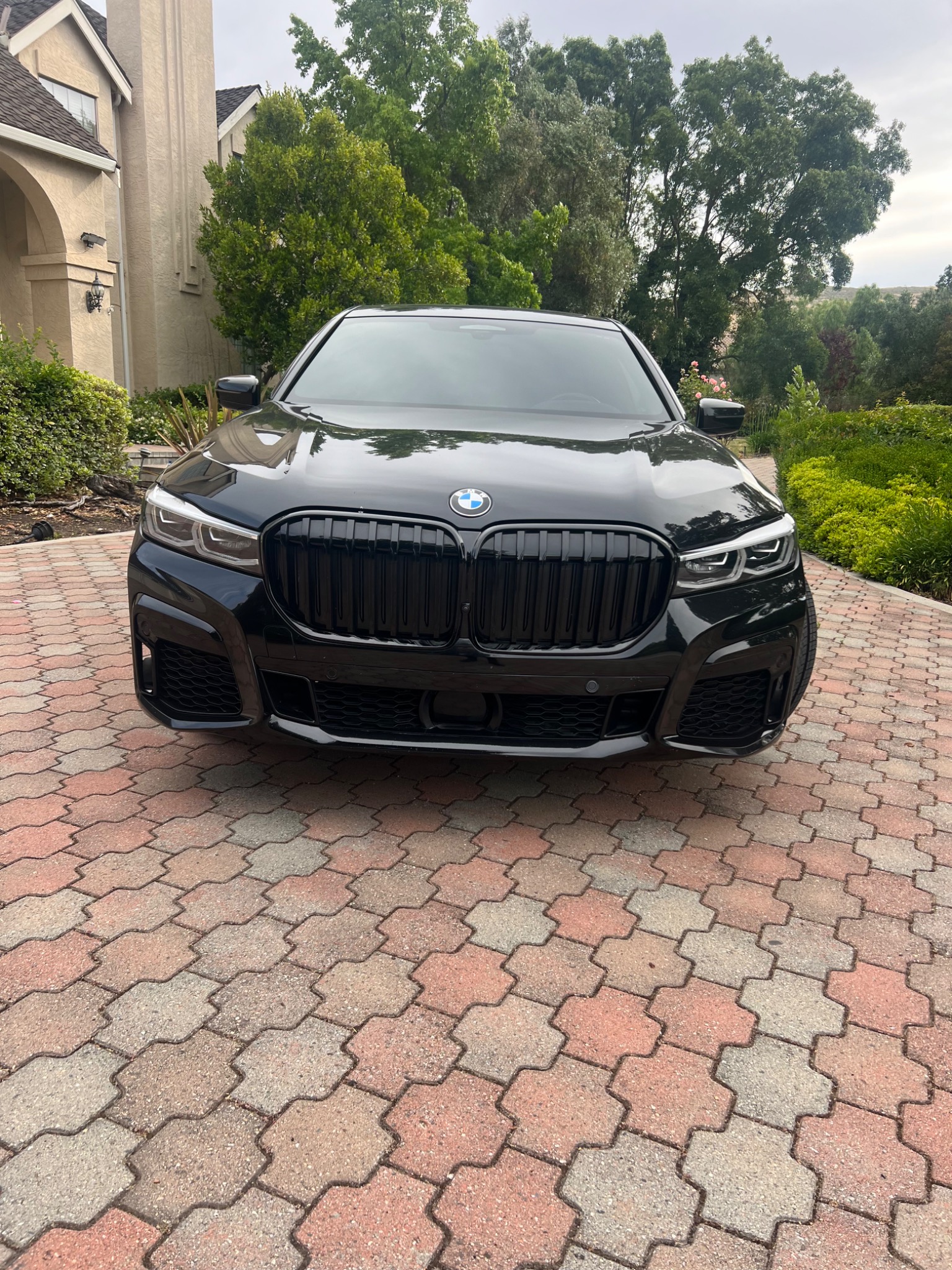 Front view of a black BMW 7 Series executive sedan